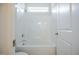 Bright and clean bathroom showcasing a shower and tub combination with white fixtures at 185 W Amber Oak Dr, Selma, NC 27576