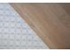 Stylish transition from wood to patterned tile flooring, adding a unique design element to the space at 186 Evington Dr, Pittsboro, NC 27312