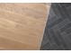 Stylish transition from wood to gray herringbone tile flooring at 186 Evington Dr, Pittsboro, NC 27312