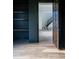 Inviting foyer with hardwood floors and staircase, showcasing a seamless blend of dark wood shelves and a light-filled area at 186 Evington Dr, Pittsboro, NC 27312