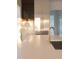 Bright kitchen features marble countertops, stainless steel refrigerator, and golden faucet fixtures at 186 Evington Dr, Pittsboro, NC 27312