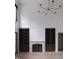 Bright living room featuring a fireplace with built-in bookcases and decorative moldings at 186 Evington Dr, Pittsboro, NC 27312