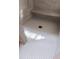 Modern shower with gray patterned tile floor and convenient built-in bench at 186 Evington Dr, Pittsboro, NC 27312