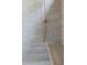 Modern walk-in shower featuring gray subway tile, a built-in bench, and a showerhead with stylish fixtures at 186 Evington Dr, Pittsboro, NC 27312