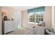 Serene Bedroom featuring a crib, dresser, and large window with a peaceful outdoor view at 201 Olive Branch St, Sanford, NC 27332