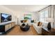 Stylish living room features a large sectional sofa, TV, and contemporary decor at 201 Olive Branch St, Sanford, NC 27332