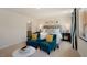 Bright main bedroom featuring carpet, neutral walls, and furniture at 201 Olive Branch St, Sanford, NC 27332