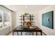 Home office features a sleek desk, stylish shelving, and plenty of natural light at 201 Olive Branch St, Sanford, NC 27332
