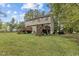 Two story home with a backyard featuring multiple decks and stairways at 204 Allen St # A/B, Creedmoor, NC 27522