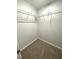 Walk-in closet features shelving for storage and plush carpet at 204 Allen St # A/B, Creedmoor, NC 27522
