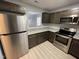 Well-appointed kitchen features stainless steel appliances, granite countertops, and stylish cabinetry at 204 Allen St # A/B, Creedmoor, NC 27522