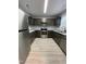 Modern kitchen boasts stainless steel appliances, ample countertop space, and stylish dark wood cabinets at 204 Allen St # A/B, Creedmoor, NC 27522