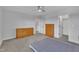 Light-filled bedroom with carpeting, two dressers and closet at 208 Tarkenton Ct, Clayton, NC 27527