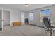 Neutral bedroom with a desk, chair, and natural light at 208 Tarkenton Ct, Clayton, NC 27527