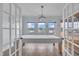 Dining room showcasing a large table, chandelier, and natural light through bright windows at 208 Tarkenton Ct, Clayton, NC 27527