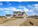 Gorgeous home with a long driveway and a two-car garage nestled in a beautiful neighborhood at 208 Tarkenton Ct, Clayton, NC 27527