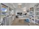Stylish home office with custom built-in shelving, recessed lighting and plenty of natural light at 208 Tarkenton Ct, Clayton, NC 27527