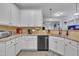 Beautiful kitchen featuring granite countertops, white cabinets and stainless steel appliances at 208 Tarkenton Ct, Clayton, NC 27527