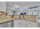 Bright kitchen featuring granite countertops, stainless steel appliances, and an open design at 208 Tarkenton Ct, Clayton, NC 27527