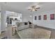Open-concept living room with neutral decor and a view of the kitchen at 208 Tarkenton Ct, Clayton, NC 27527