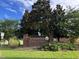 Riverwood Middle School brick sign surrounded by landscaped lawn and mature trees at 208 Tarkenton Ct, Clayton, NC 27527