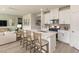 Well-lit kitchen with a spacious island featuring counter seating and stainless steel appliances at 2118 Cherry Creek Rd, Haw River, NC 27258