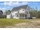 The back exterior features a screened-in porch and a spacious yard, perfect for outdoor enjoyment at 216 Meadow Walk Dr, Fuquay Varina, NC 27526