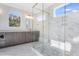 Bathroom with large glass shower and marble tile at 216 Meadow Walk Dr, Fuquay Varina, NC 27526