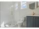 Modern bathroom with tiled shower, matte fixtures, and a single vanity at 216 Meadow Walk Dr, Fuquay Varina, NC 27526