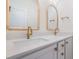 Double sink bathroom vanity with modern gold fixtures, quartz countertop, and natural wood framed mirrors at 216 Meadow Walk Dr, Fuquay Varina, NC 27526