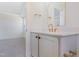 Bathroom sink vanity with gold fixtures, quartz countertop and view of a large bedroom at 216 Meadow Walk Dr, Fuquay Varina, NC 27526