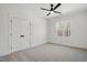 Cozy bedroom with neutral carpet, closet, and a large window at 216 Meadow Walk Dr, Fuquay Varina, NC 27526
