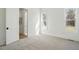 Light-filled bedroom featuring neutral carpet, and large windows at 216 Meadow Walk Dr, Fuquay Varina, NC 27526