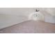 Spacious bonus room with neutral carpet, ample natural light, and a ceiling fan at 216 Meadow Walk Dr, Fuquay Varina, NC 27526
