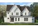 Charming two-story home with white brick and siding, complemented by a well-manicured lawn at 216 Meadow Walk Dr, Fuquay Varina, NC 27526