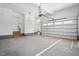 Spacious two car garage with a side entry door and white paint at 216 Meadow Walk Dr, Fuquay Varina, NC 27526