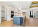 Open kitchen design featuring an island with a gold faucet and stainless steel appliances at 216 Meadow Walk Dr, Fuquay Varina, NC 27526