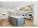 Bright kitchen with a large island, stainless steel appliances, and hardwood floors at 216 Meadow Walk Dr, Fuquay Varina, NC 27526