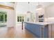 Open concept kitchen features gray island with white countertops and stainless steel appliances at 216 Meadow Walk Dr, Fuquay Varina, NC 27526