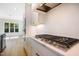 Modern kitchen features white cabinetry, stainless steel appliances, and an island at 216 Meadow Walk Dr, Fuquay Varina, NC 27526