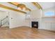 Spacious living room featuring a fireplace, custom built-ins, and hardwood floors at 216 Meadow Walk Dr, Fuquay Varina, NC 27526