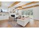 Cozy living room with exposed beams, fireplace, and an open concept design at 216 Meadow Walk Dr, Fuquay Varina, NC 27526