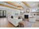 Bright living room featuring a fireplace, built-in shelving, and hardwood floors at 216 Meadow Walk Dr, Fuquay Varina, NC 27526