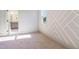 Bright bedroom with large windows and textured accent wall at 216 Meadow Walk Dr, Fuquay Varina, NC 27526