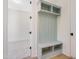 Hallway mudroom boasts a built-in bench with coat hooks and upper storage at 216 Meadow Walk Dr, Fuquay Varina, NC 27526