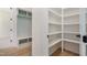 Mudroom features built-in shelves and storage adjacent to the pantry at 216 Meadow Walk Dr, Fuquay Varina, NC 27526