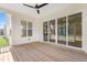 Screened-in porch with sliding glass doors, wooden floors and ceiling fan at 216 Meadow Walk Dr, Fuquay Varina, NC 27526