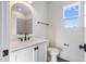 Elegant powder room featuring a modern vanity, gold mirror, and sleek fixtures at 216 Meadow Walk Dr, Fuquay Varina, NC 27526