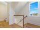 Bright staircase with natural light and hardwood floors leads to the second story at 216 Meadow Walk Dr, Fuquay Varina, NC 27526