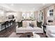Bright, open-concept living area connecting the kitchen, dining, and living spaces for modern living at 233 Shingle Oak Rd, Wake Forest, NC 27587
